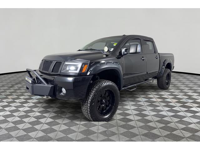 Black 2014 Nissan Titan SL Crew Cab 4WD Pickup Truck Four-Wheel Drive 5-Speed Automatic